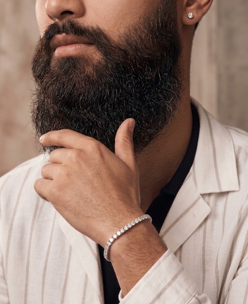 A diamond tennis bracelet worn on the wrist